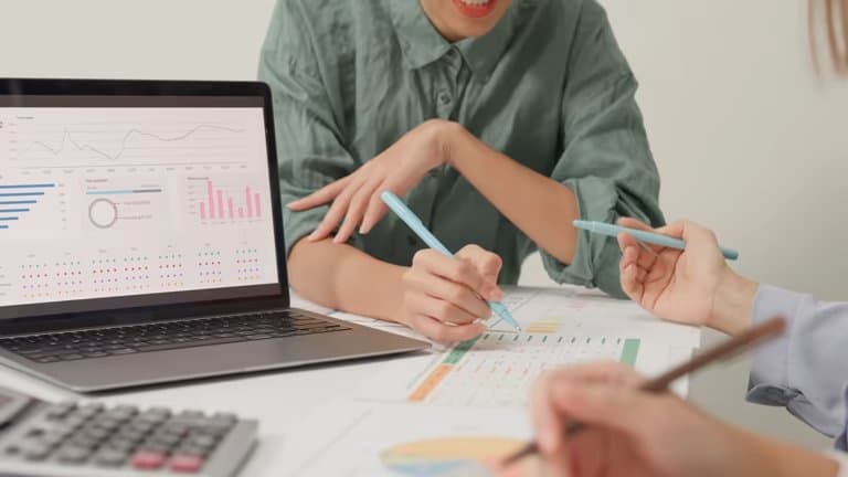 Melbourne accountant reviewing financial reports at desk